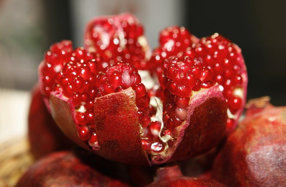 cut open red pomegranate fruit